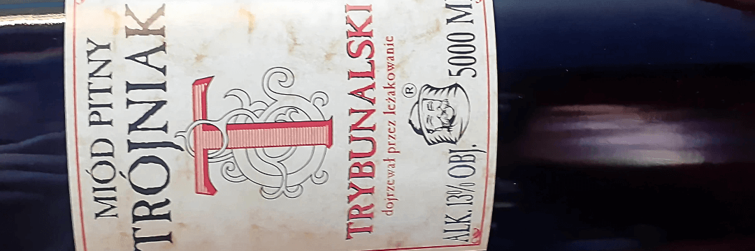 Potężna, szklana butla Trójniaka Trybunalskiego